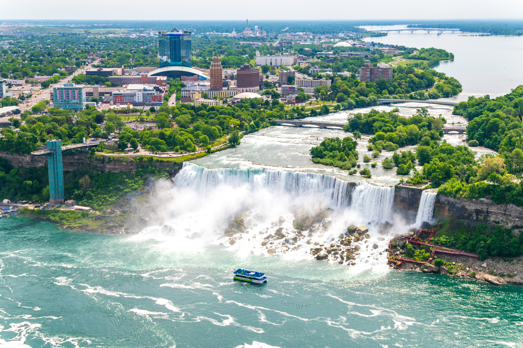 Aerial view of Niagara Falls with a tour boat nearby