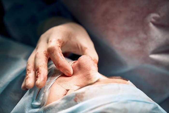 doctors hand and patients nose close-up