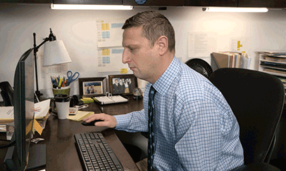 Man slams his computer mouse over and over