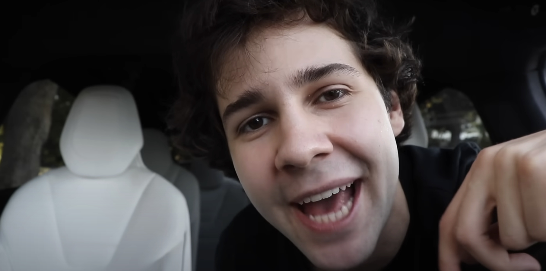 David Dobrik smiles