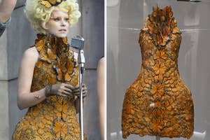 Effie Trinket character from "The Hunger Games" in butterfly dress next to the dress on display