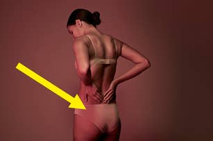Person in undergarments showing back muscles and a posture that suggests body confidence