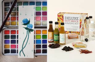 A watercolor paint set alongside a finished floral painting, and a deluxe hot sauce making kit with ingredients and bottles