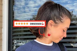 reviewer wearing cherry earrings