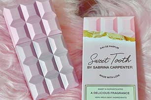 A perfume bottle labeled "Sweet Tooth by Sabrina Carpenter" next to its packaging