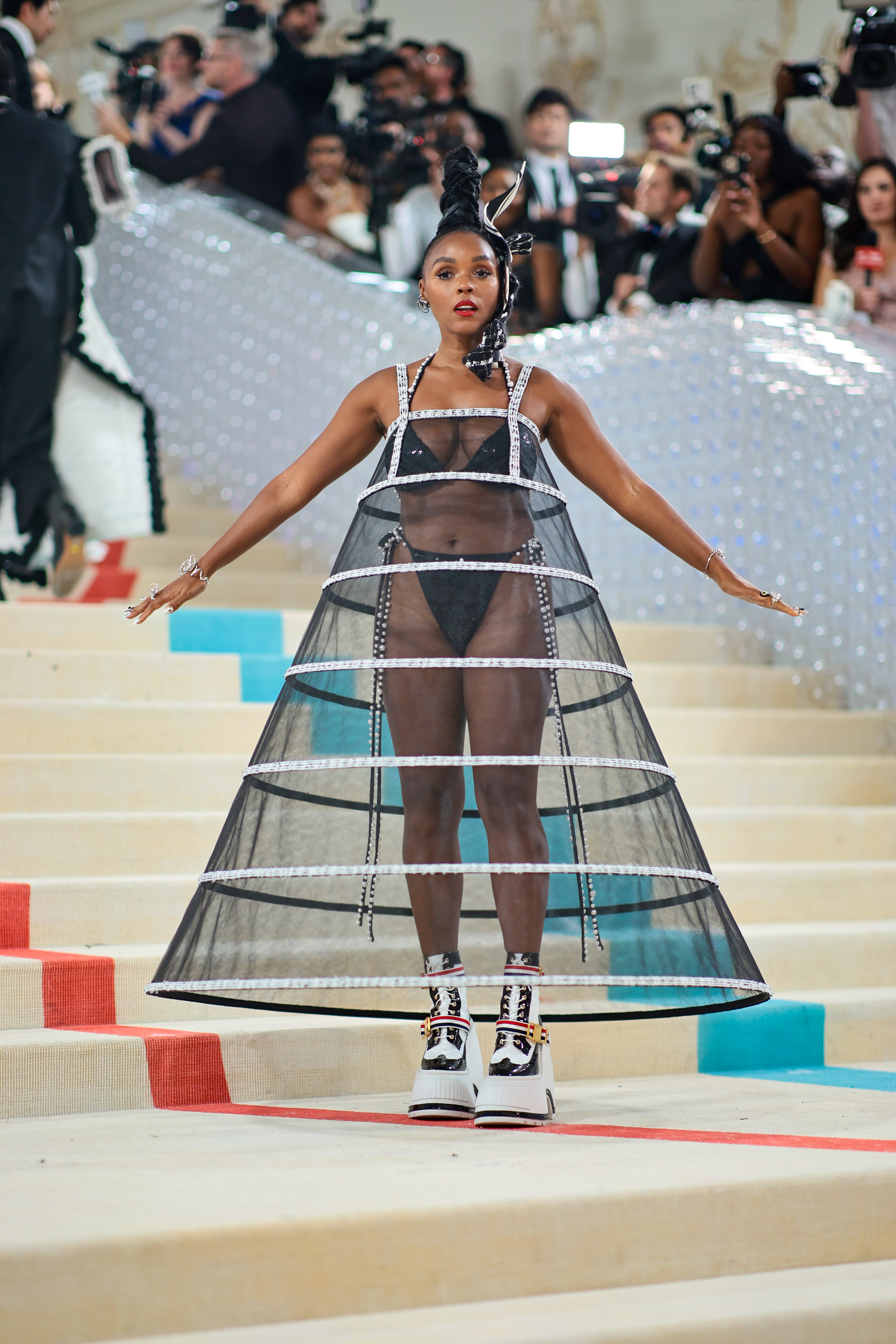 Janelle Monáe without the jacket revealing a bikini-like outfit underneath