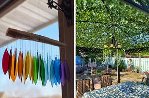 Colorful glass wind chimes hanging on a porch / a pergola with vines over the top of it
