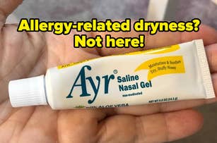 Hand holding a tube of Ayr Saline Nasal Gel with text that reads Allergy-related dryness, Not here