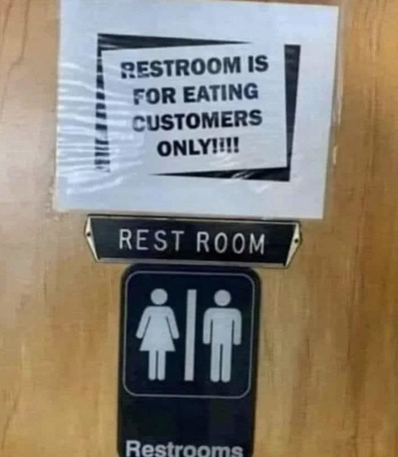 Sign states &quot;RESTROOM IS FOR EATING CUSTOMERS ONLY,&quot; above a standard restroom sign with male and female symbols