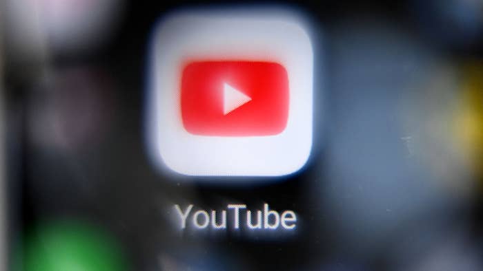 Close-up of the YouTube app icon on a digital screen