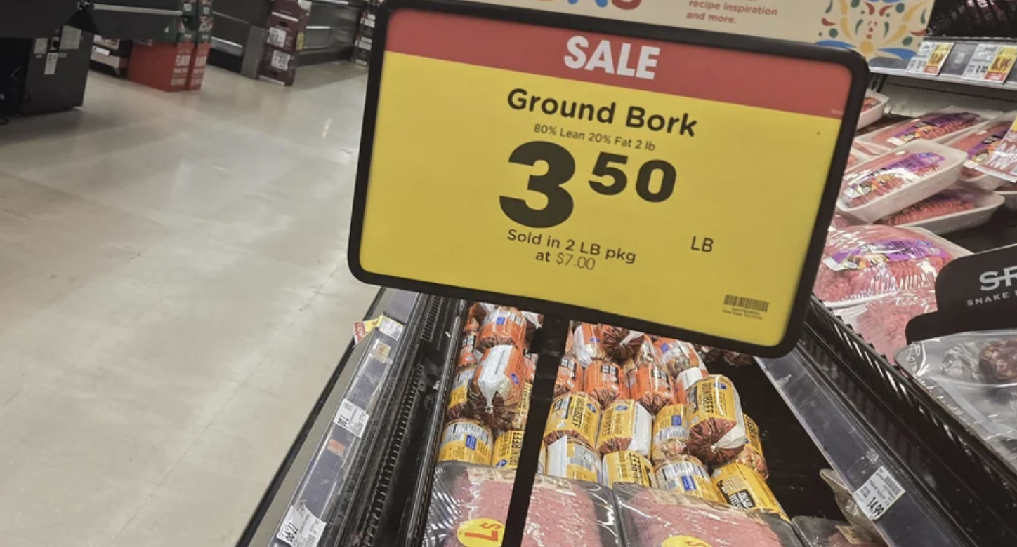 Sale sign for &quot;Ground Bork&quot; at $3.50 per pound, indicating a grocery store meat section