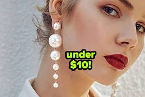 model wearing tiered faux pearl drop earrings