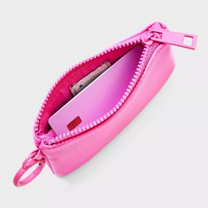 the pink zip-up mini wallet shown open and unzipped