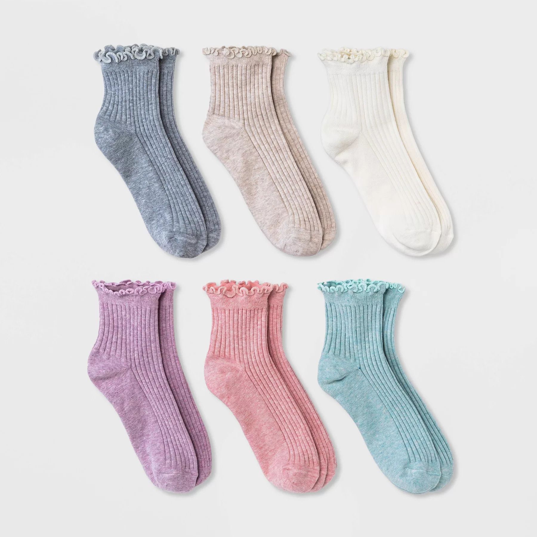 Six pairs of ribbed ankle socks with ruffled cuffs in colors: gray, beige, white, purple, pink, and mint green