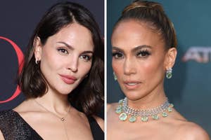 Eiza Gonzalez and Jennifer Lopez on red carpet, Eiza wearing a sleeveless black dress, Jennifer wearing a statement necklace and earrings