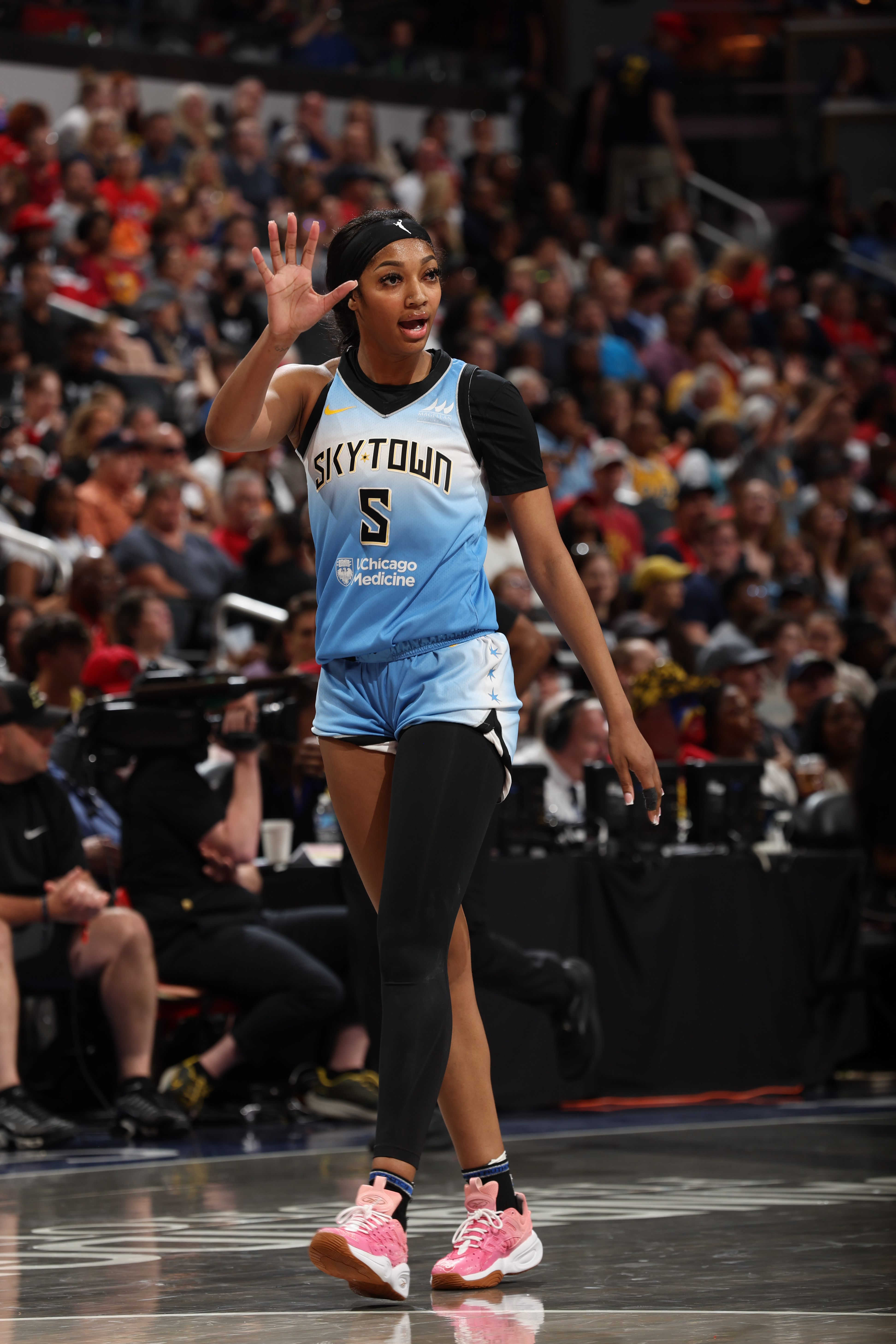 Fans Share Mixed Reactions to Angel Reese Cheering as Caitlin Clark Is  Knocked to the Ground | Complex