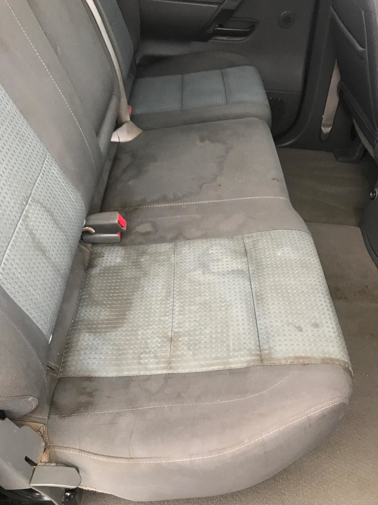 Car backseat with noticeable h2o  stains and wear. Unsightly cloth  information  suggesting a request   for cleaning oregon  replacement, applicable  to readers considering car   spot   covers