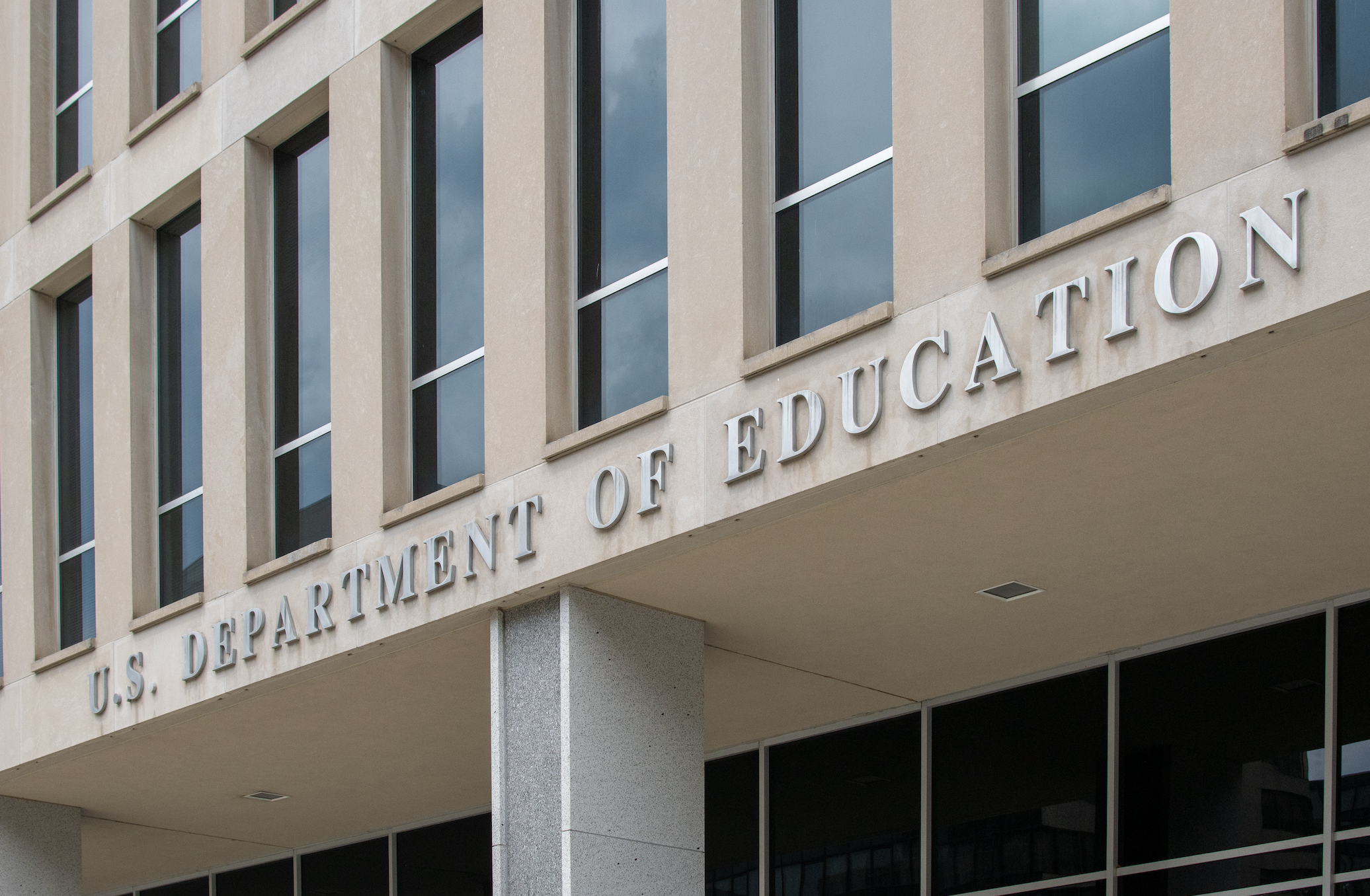 Exterior of U.S. Department of Education building with windows and sign
