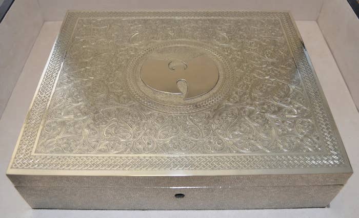 An intricately designed metal box featuring the Wu-Tang Clan&#x27;s logo on its lid