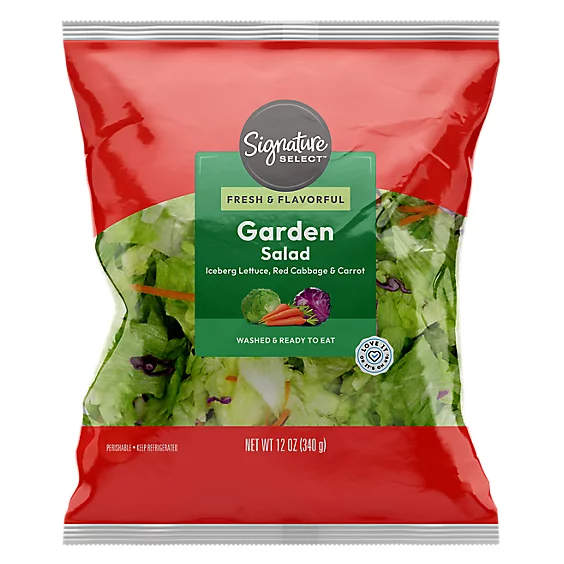 Bag of Signature Select Garden Salad, 12 oz, containing iceberg lettuce, red cabbage, and carrots, labeled "Fresh & Flavorful" and "Washed & Ready to Eat."