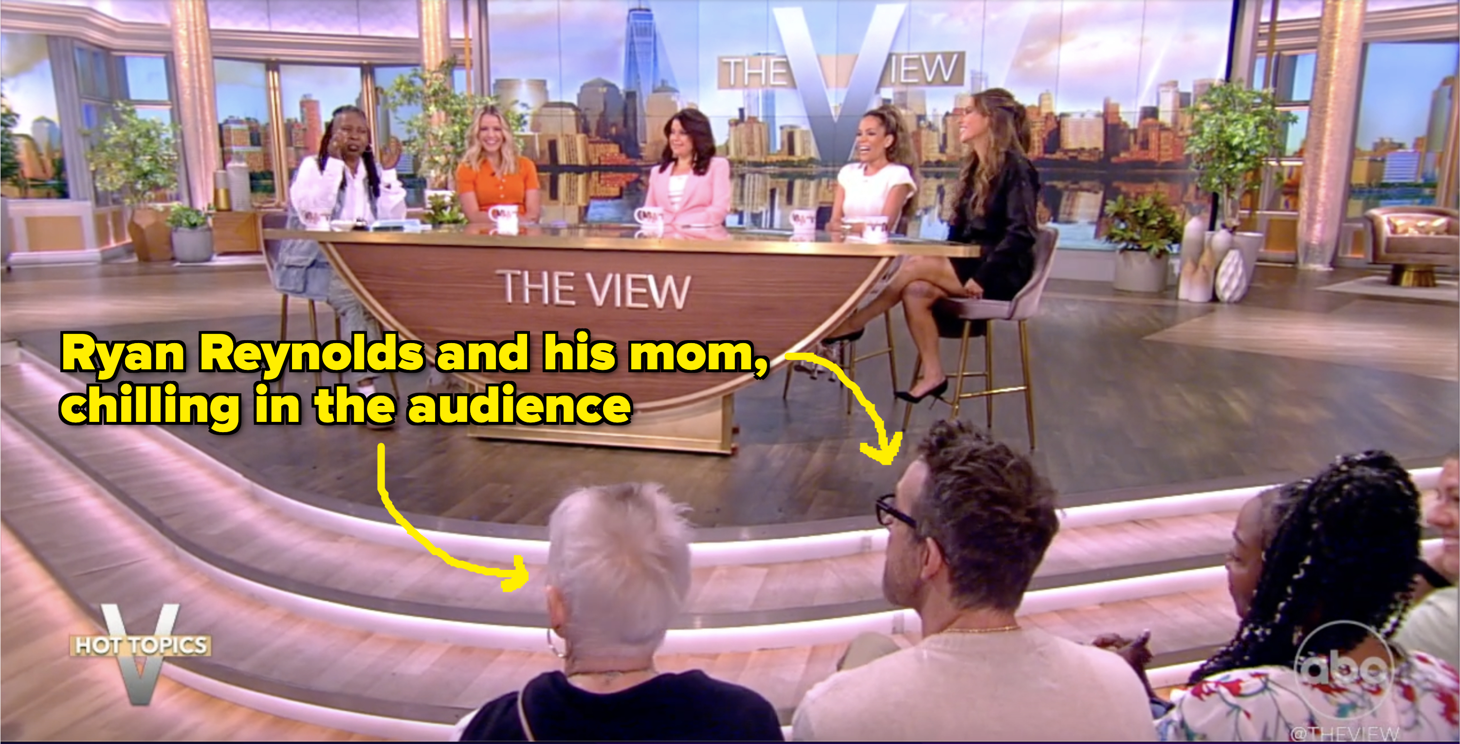 Whoopi Goldberg, Sara Haines, Alyssa Farah Griffin, and two unidentified women seated at "The View" talk show desk, with a live audience watching