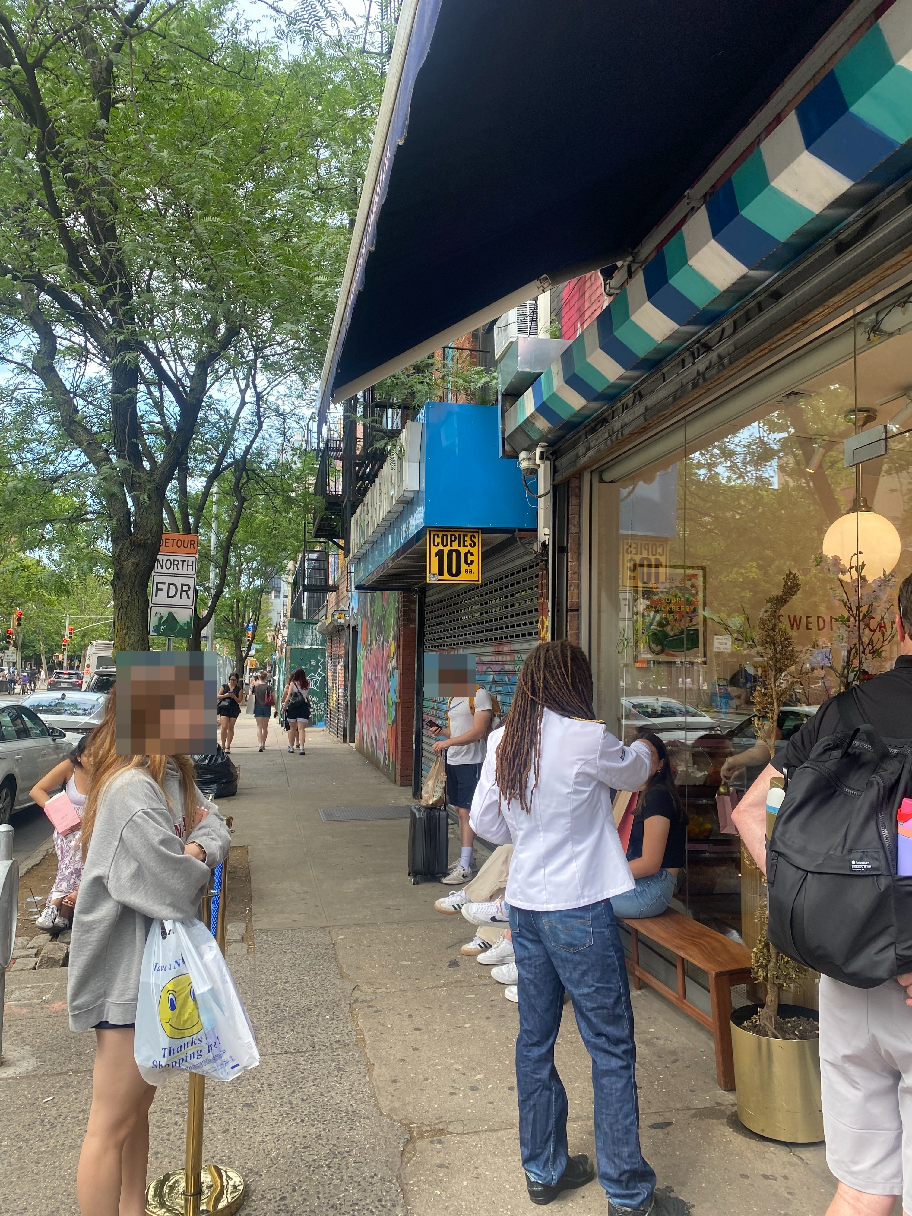 People wait in line outside BonBon candy store