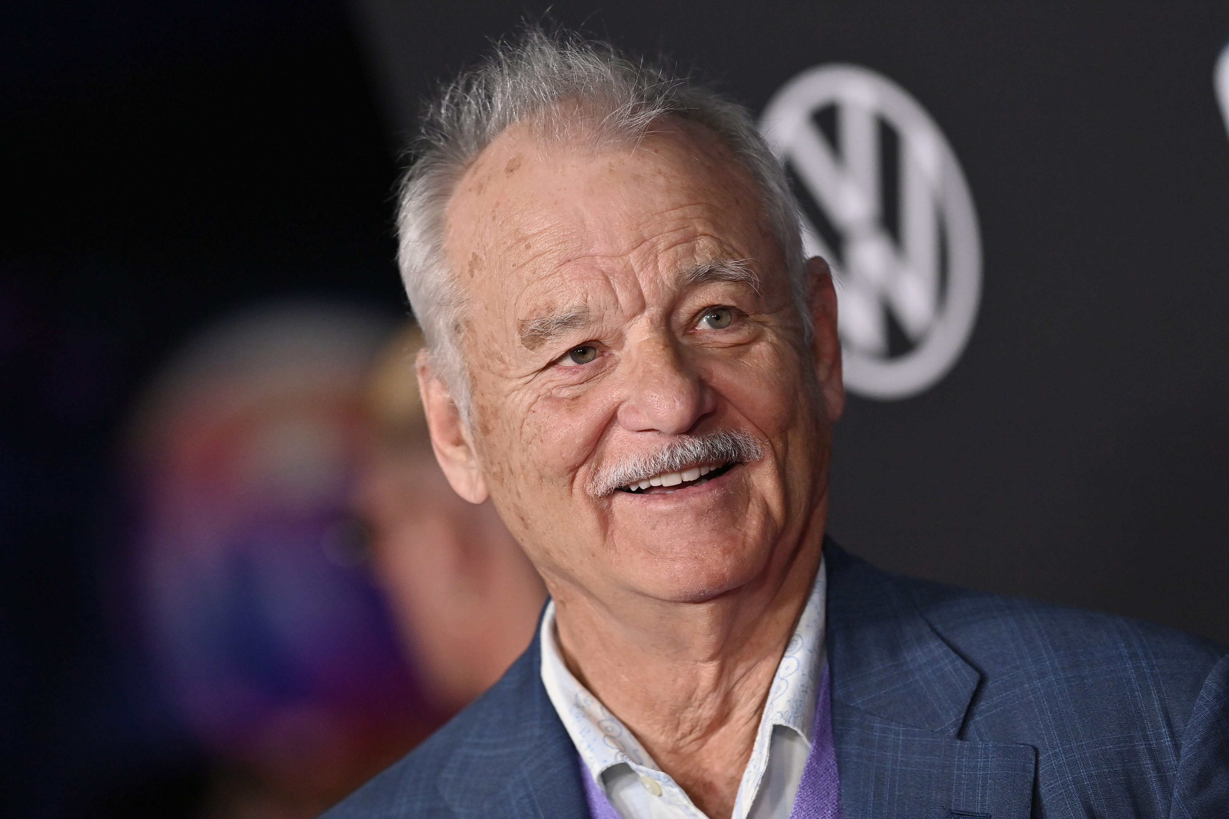 Bill Murray at a Marvel event smiling.