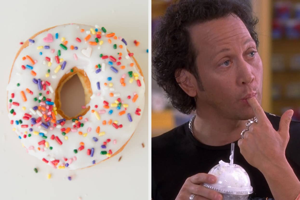 A sprinkled donut is on the left, and a man with curly hair wearing a black shirt is on the right, licking his finger while holding a drink