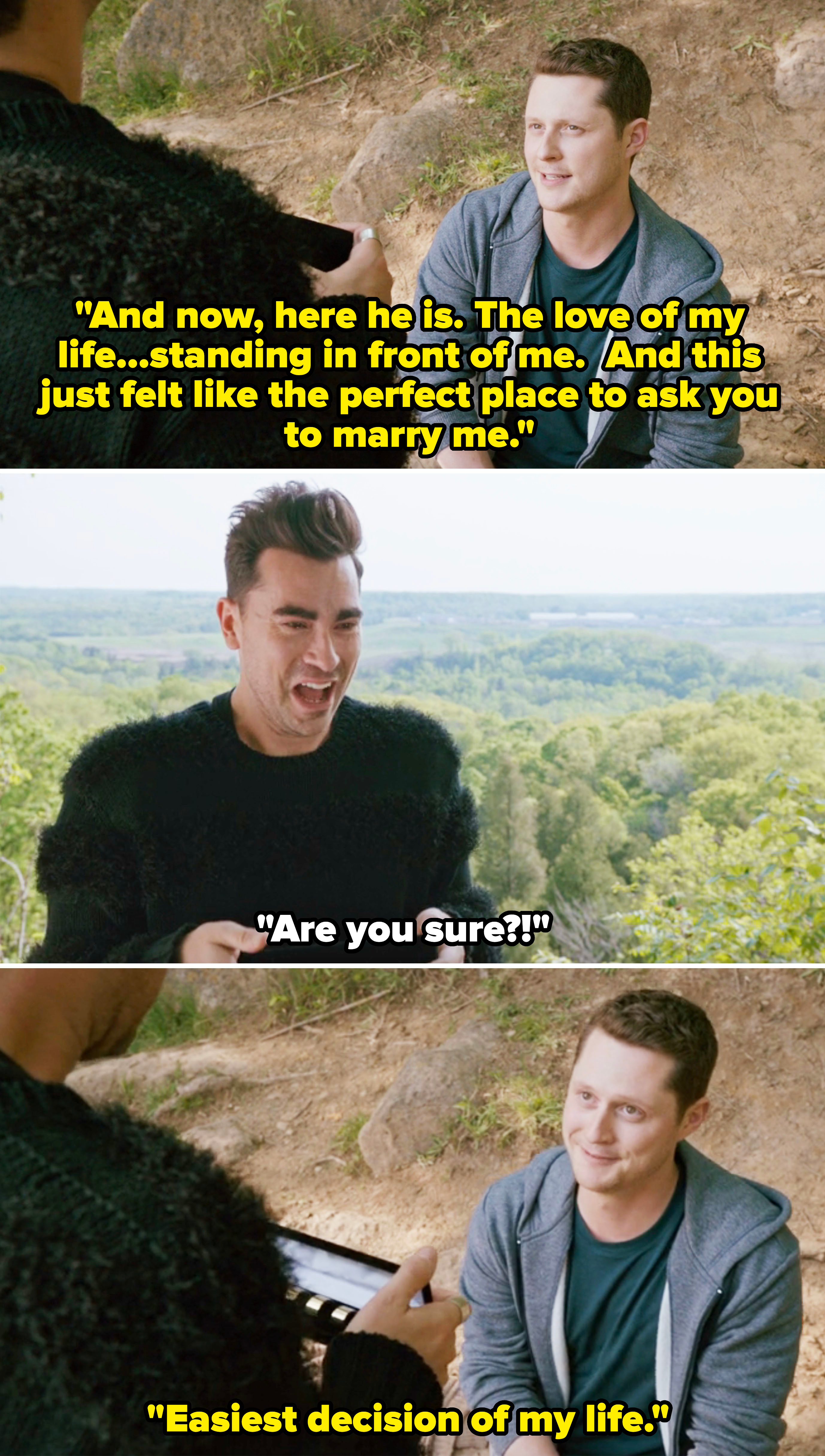 Dan Levy and Noah Reid in an outdoor scene from &quot;Schitt's Creek&quot;, laughing and interacting while holding a ring box