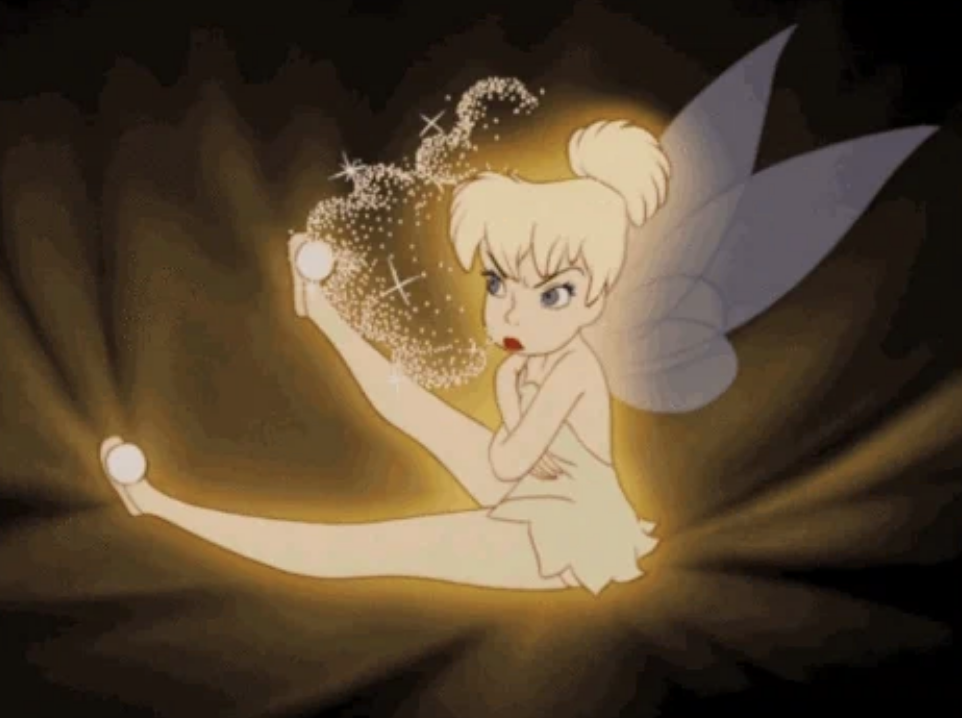 Tinker Bell from Peter Pan sits with legs extended, sprinkling pixie dust from her hand, looking determined