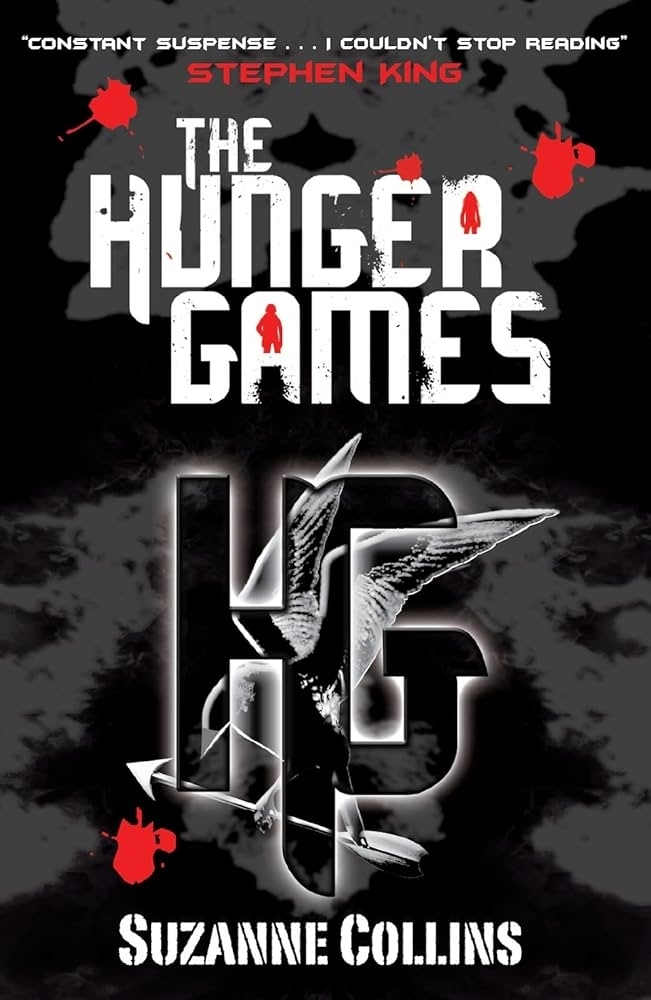 The Hunger Games book cover by Suzanne Collins. Black background, text says "Constant suspense… I couldn't stop reading" by Stephen King.