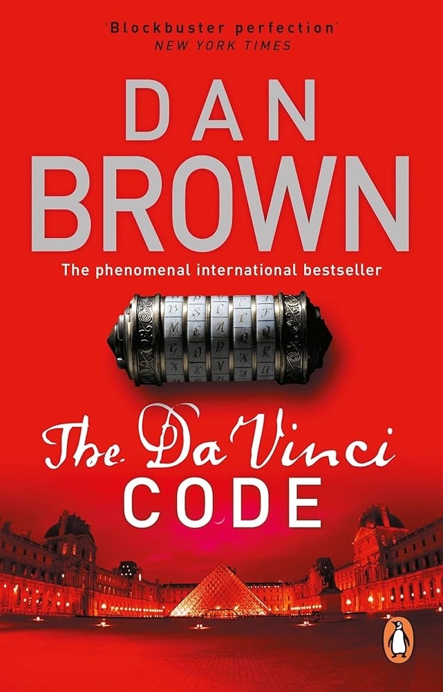 Book cover of "The Da Vinci Code" by Dan Brown featuring a cryptex device and the Louvre Pyramid in Paris