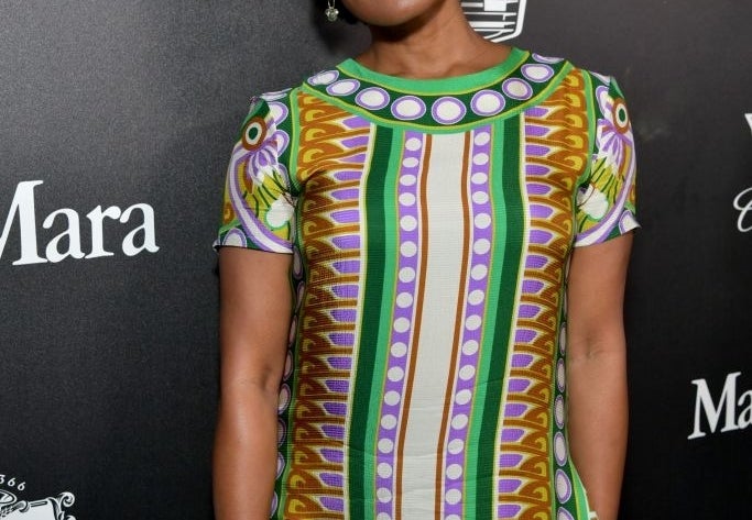 Robinne Lee poses in a patterned dress at a Women in Film (WIF) event