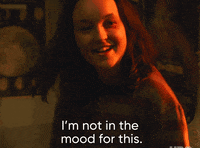 Shiv Roy, a character from the HBO series "Succession," says, "I'm not in the mood for this," while smiling