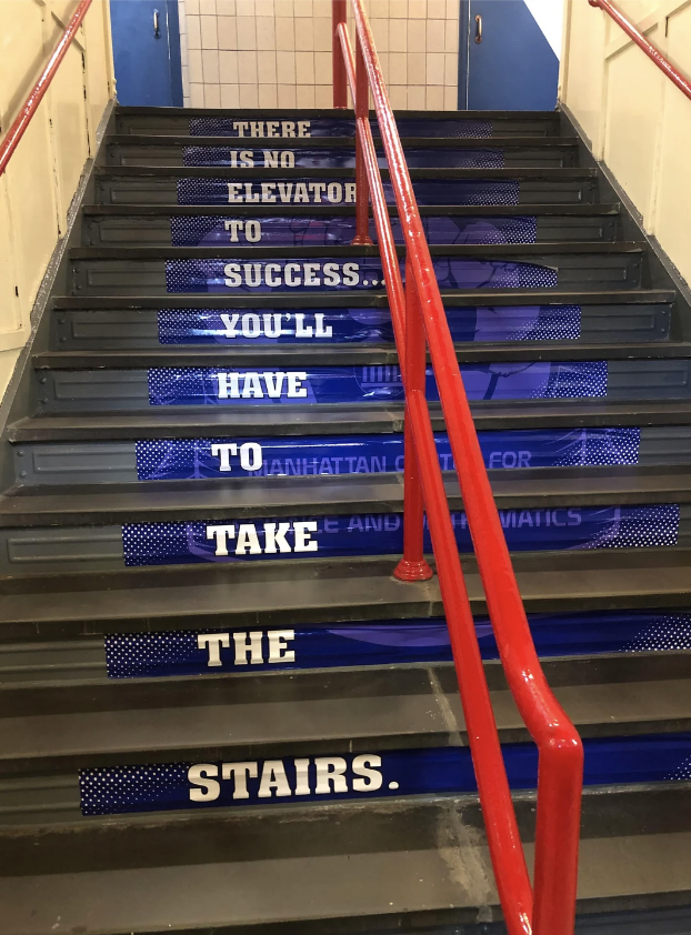 A staircase with a motivational message: &quot;There is no elevator to success. You&#x27;ll have to take the stairs.&quot;