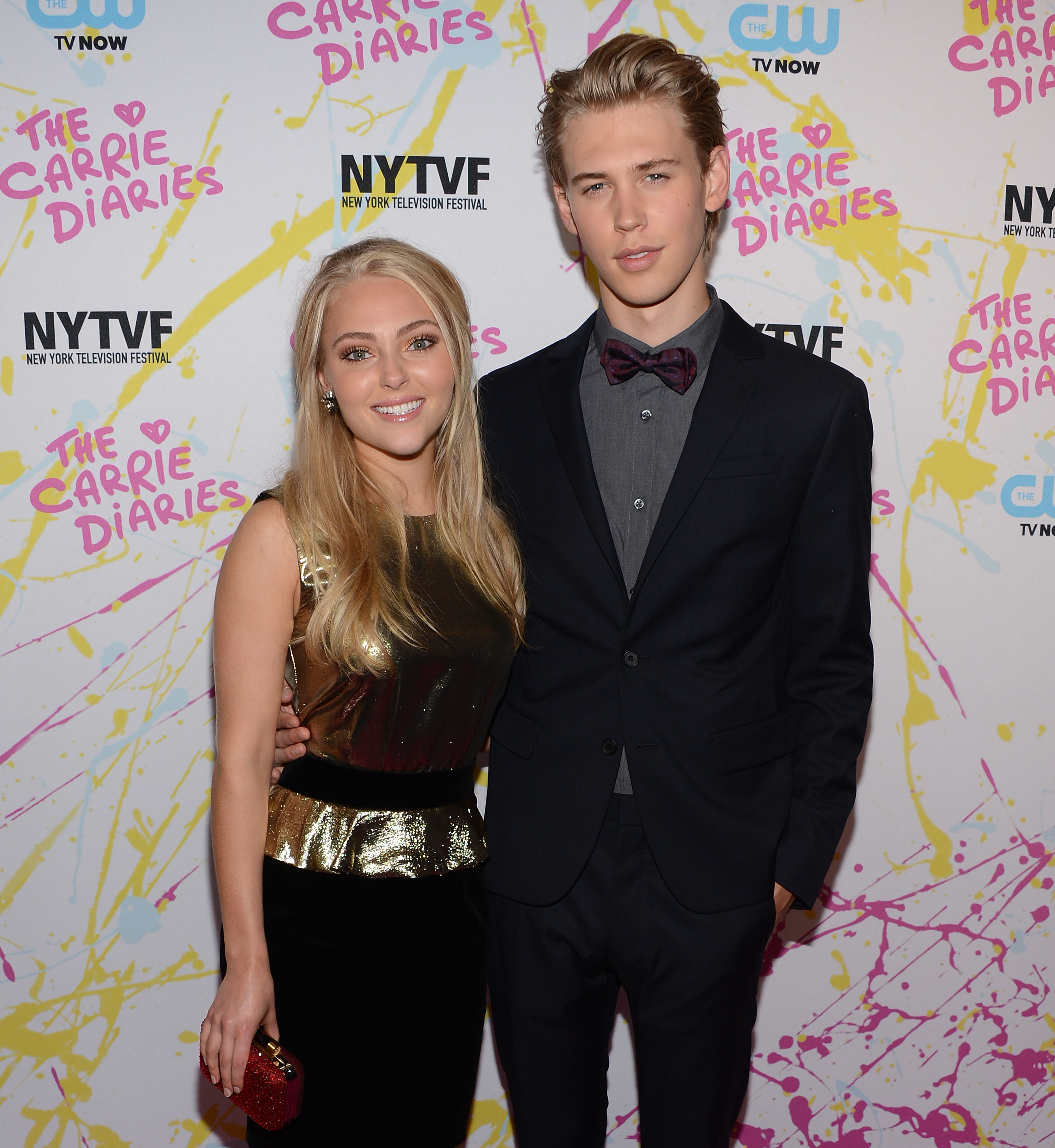 AnnaSophia Robb in a sleeveless sequin dress and Austin Butler in a suit with a bow tie pose together at &quot;The Carrie Diaries&quot; event backdrop