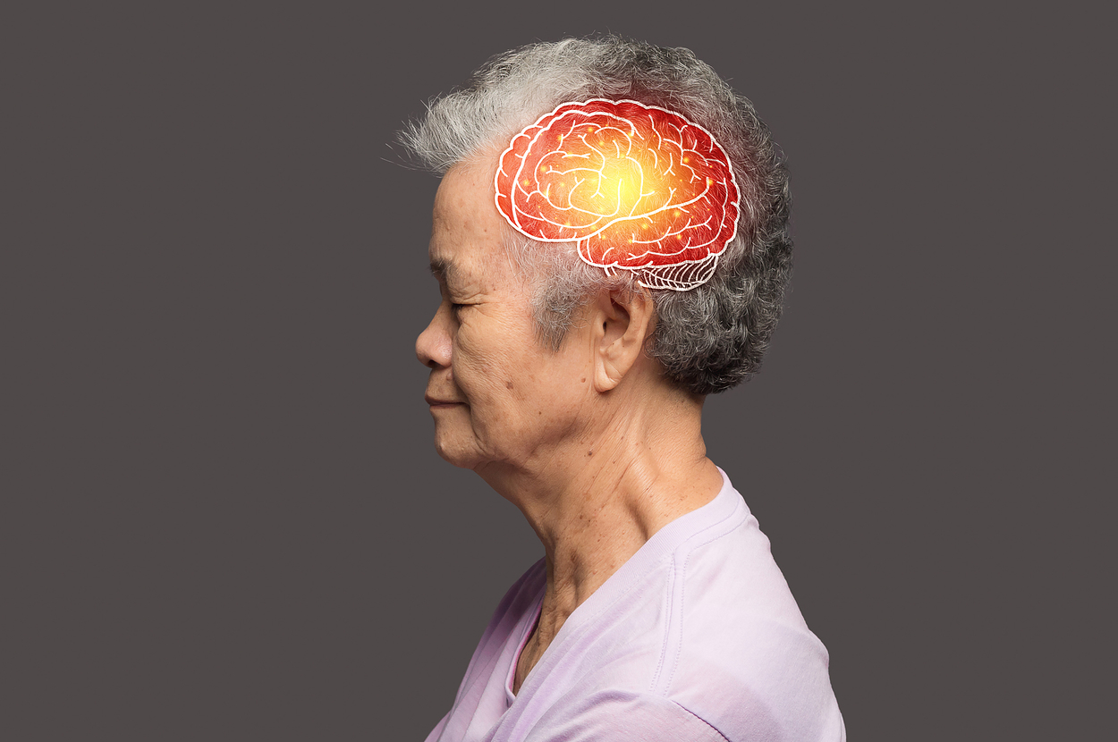 An elderly person is shown in profile with an illustration of a brain highlighted with red and yellow colors, indicating a focus on brain health or activity