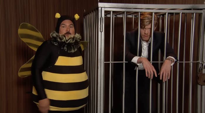 Screenshot from "Jimmy Kimmel Live" with Guillermo in a bee costume and Jesse Plemons in a cage