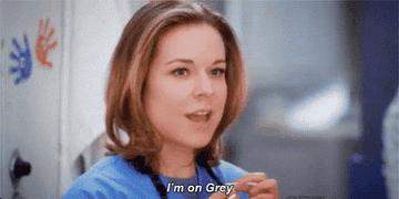 Heather Brooks in scrubs exclaims, "I'm on Grey!"