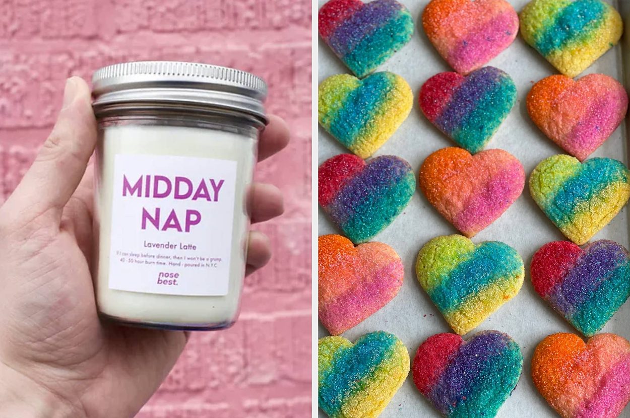 A hand holds a "Midday Nap" lavender latte-scented candle. Next to it are rainbow heart-shaped cookies on a tray