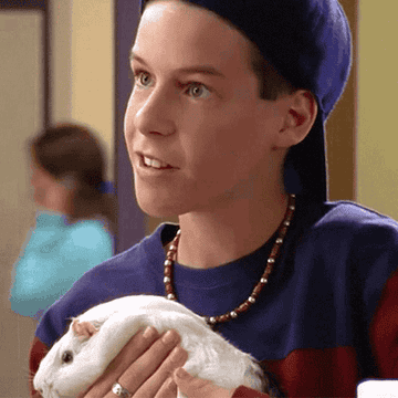 J.T. holds a bunny and smiles.