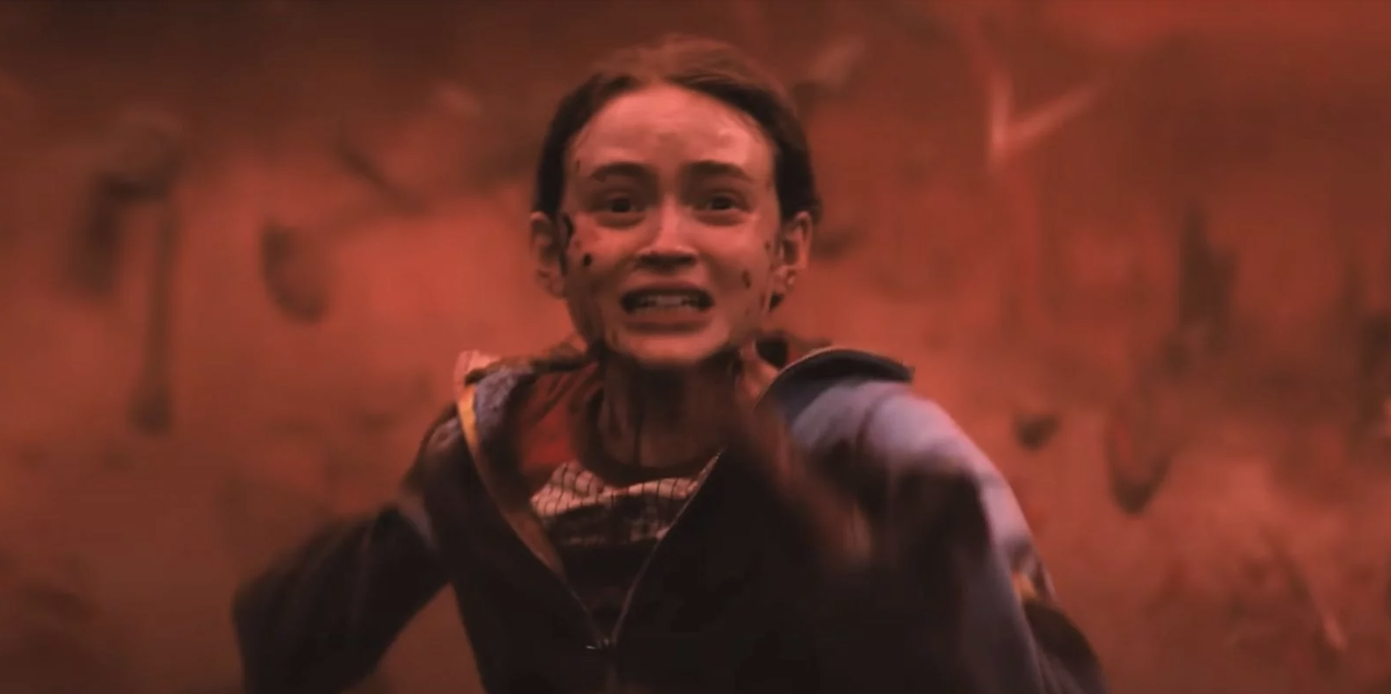 Sadie Sink appears distressed in an intense scene from &quot;Stranger Things,&quot; running with a fearful expression