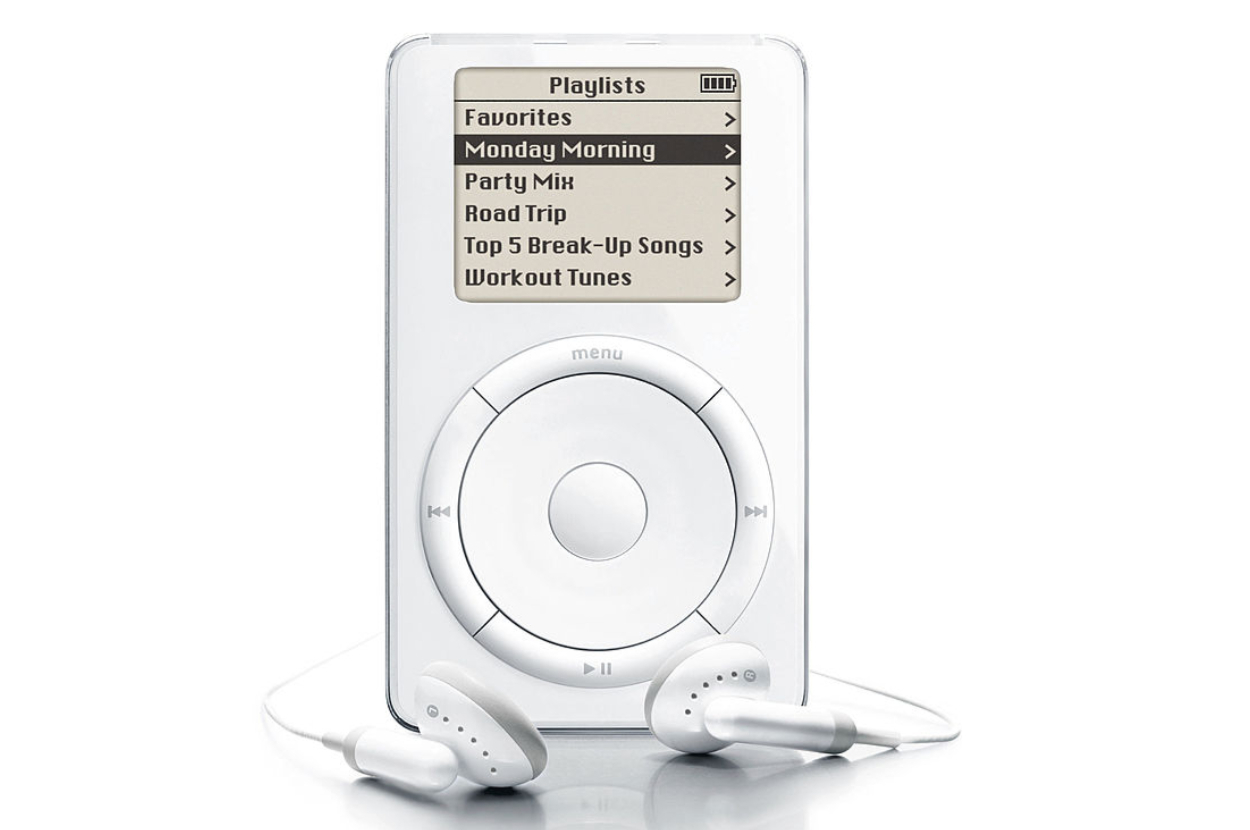 An early model iPod displaying a playlist menu with options: Favorites, Monday Morning, Party Mix, Road Trip, Top 5 Break-Up Songs, and Workout Tunes. Earbuds are attached