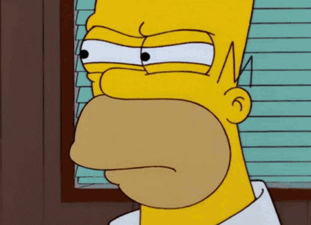 Homer Simpson, a character from "The Simpsons," looking suspiciously to the right. This image is often used in memes and internet humor