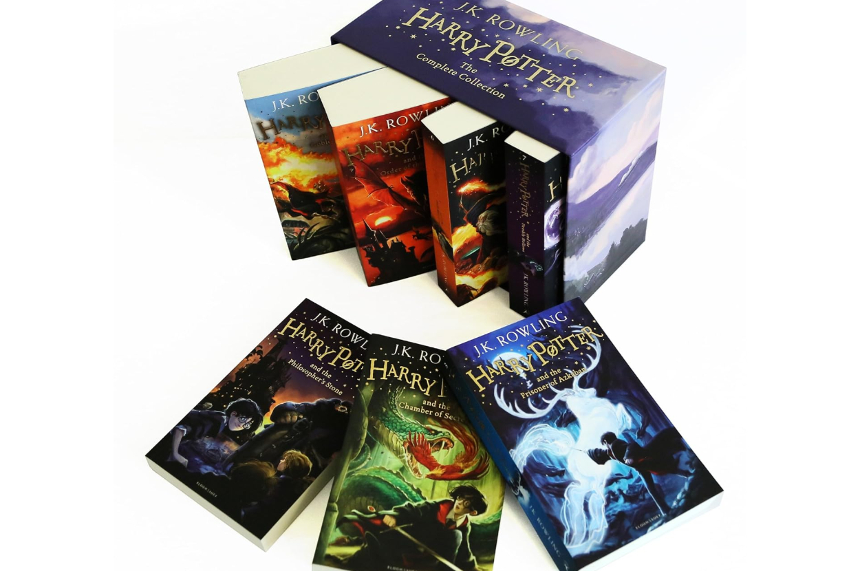 Harry Potter book series box set by J.K. Rowling. Includes all seven books with various cover illustrations. Box showcases magical scenes and title