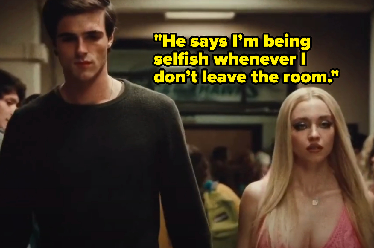 Jacob Elordi and Sydney Sweeney walking in a school hallway scene. Jacob wears a dark shirt, and Sydney has long blonde hair and wears a light-colored top
