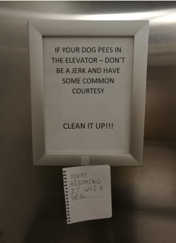 Sign saying, "IF YOUR DOG PEES IN THE ELEVATOR – DON'T BE A JERK AND HAVE SOME COMMON COURTESY. CLEAN IT UP!!!" with a note below reading, "YOU'RE ASSUMING IT WAS A DOG…"