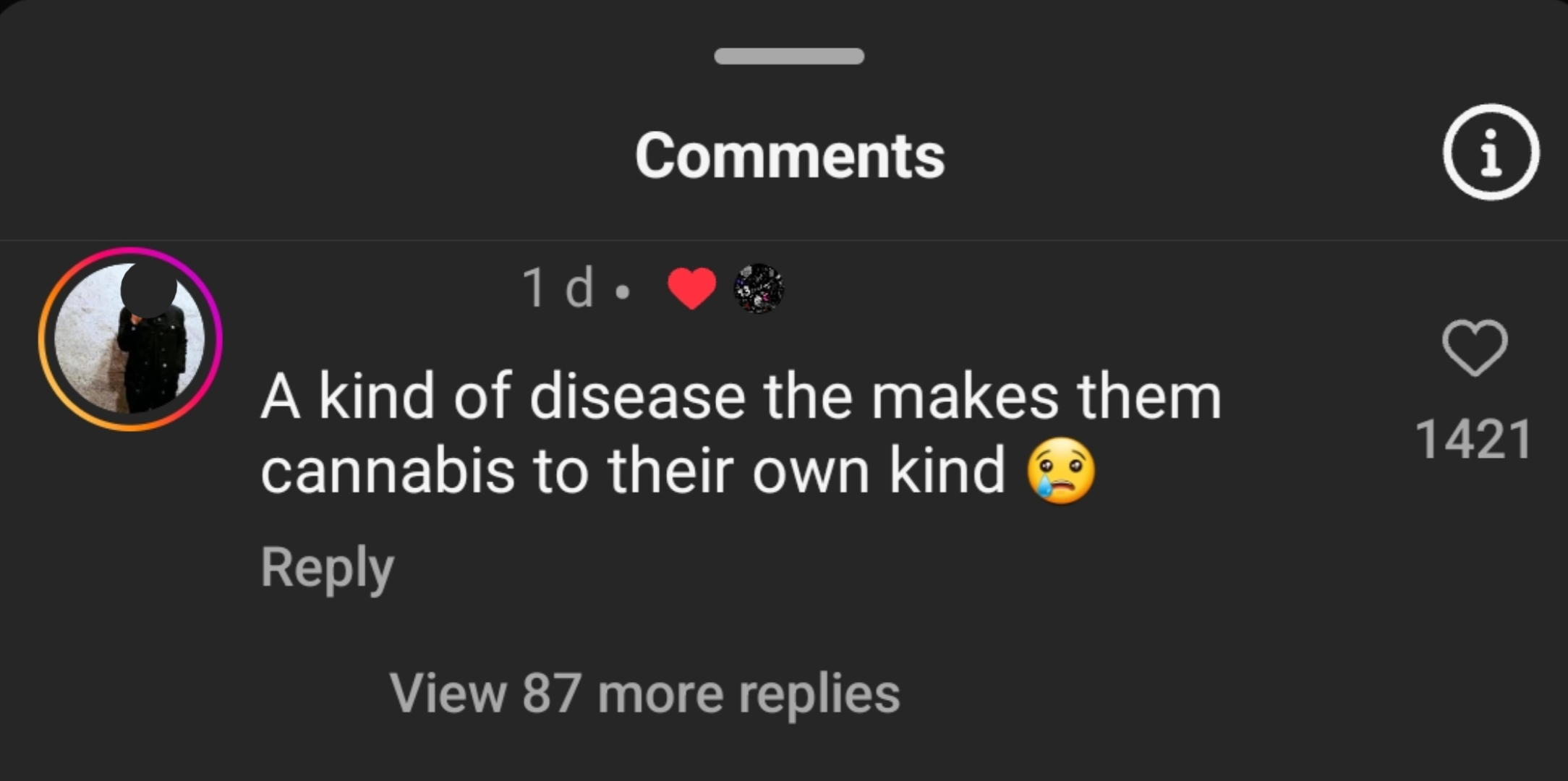 A social media comment saying, &quot;A kind of disease that makes them cannabis to their own kind,&quot; with a sad face emoji. The comment has 1,421 likes