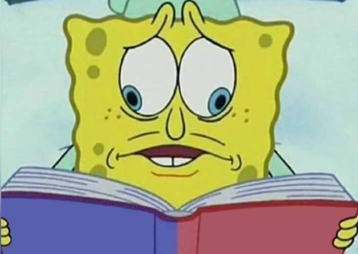 SpongeBob SquarePants looking concerned while reading a book