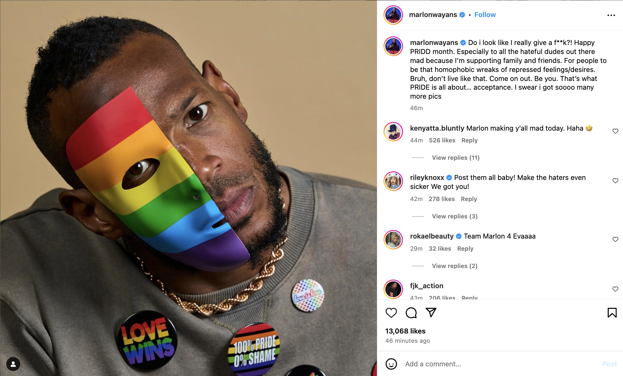 Marlon Wayans wearing a rainbow mask with pride-themed buttons on his jacket. Instagram post caption reads, &quot;Do I look like I really give a h**? Happy PRIDE month,&quot; with supportive comments